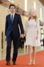 <p>Walking hand in hand to the ceremony of the Commonwealth Heads of Government Meeting in Valletta, Canada</p>