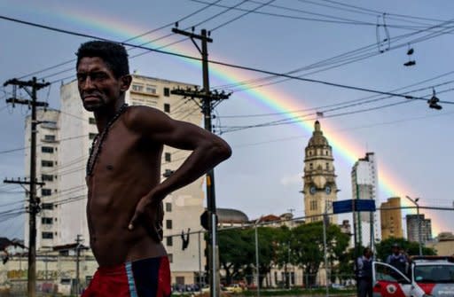 A homeless man walks in the street, in an area called "Cracolandia" (Crackland in English), in downtown Sao Paulo, Brazil on January 14. A muscular police operation to evict drug users from central Sao Paulo is triggering howls of protest from rights groups who say the crackdown's aim is to sanitize the area for developers