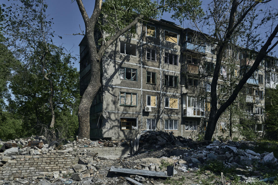 FILE - An abandoned apartment building damaged in the Russian shelling is seen in Chasiv Yar, the site of heavy battles with the Russian forces in the Donetsk region, Ukraine, May 16, 2023. Leaders of the Group of Seven advanced economies are generally united in voicing concern about China. The question is how to translate that worry into action. (AP Photo/Libkos, File)