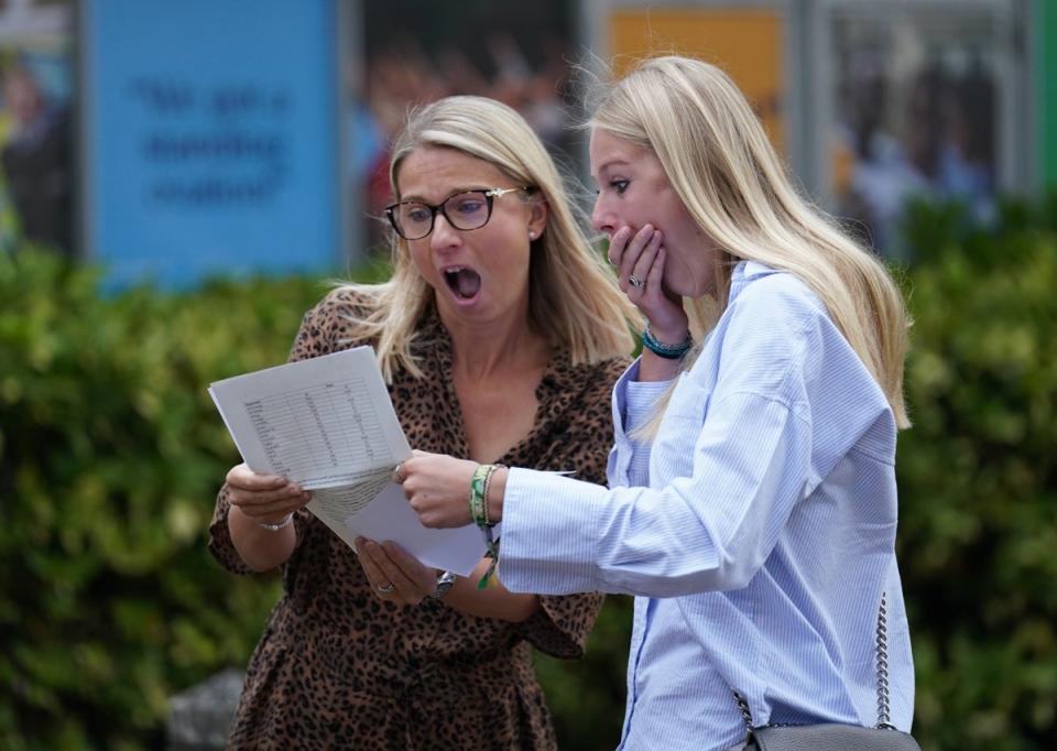 Maddie Hallam with her mother receiving her GCSE results at Norwich School, in Norfolk (Joe Giddens/PA) (PA Wire)