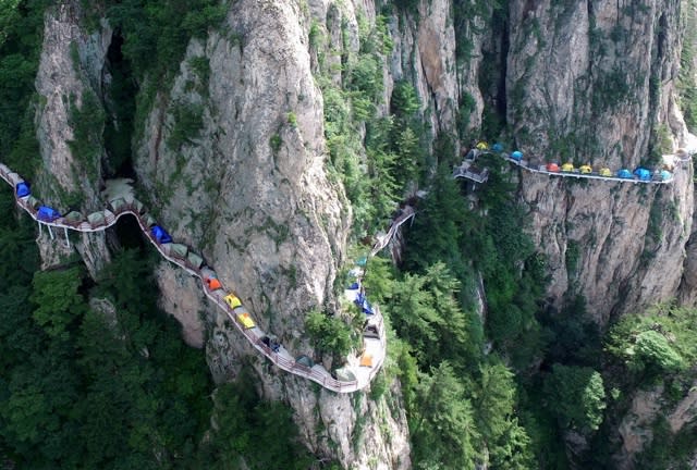 Tourists set up camp on 1,700m high cliff edge