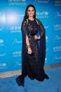 <p>To the Snowflake Ball in 2012 Katy wore a stunning blue sequin dress with matching sheer cape. [Photo: Getty] </p>