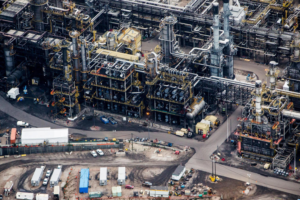 The Suncor Energy Inc. Millennium upgrader plant is seen in this aerial photograph taken above the Athabasca oil sands near Fort McMurray, Alberta, Canada, on Monday, Sept. 10, 2018. While the upfront spending on a mine tends to be costlier than developing more common oil-sands wells, their decades-long lifespans can make them lucrative in the future for companies willing to wait. Photographer: Ben Nelms/Bloomberg via Getty Images