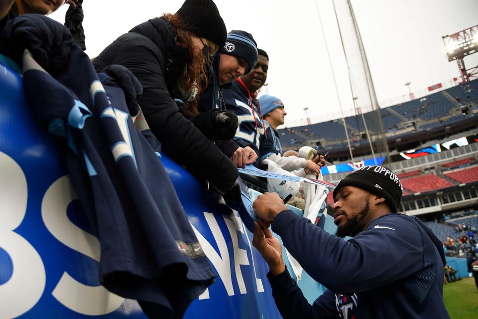 Tennessee Titans free safety Kevin Byard (31) signs autographs for fans before facing the Miami Dolphins at Nissan Stadium Sunday, Jan. 2, 2022 in Nashville, Tenn. 