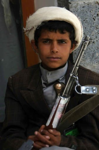 A Yemeni 11-year-old boy holds a firearm as he attends a tribal gathering in Sanaa, aimed at resolving local feuds in Arhab district. The Yemeni army has seized the Al-Qaeda strongholds of Jaar and Zinjibar, more than a year after the jihadists captured most of Abyan province