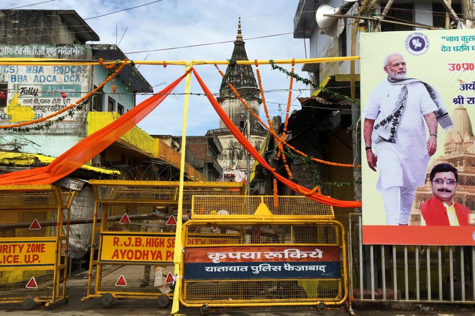 Police block a road before the arrival of India's Prime Minister to participate in the groundbreaking ceremony of the Ram Temple in Ayodhya on August 5, 2020. - India's Prime Minister Narendra Modi will lay the foundation stone for a grand Hindu temple in a highly anticipated ceremony on August 5 at a holy site that was bitterly contested by Muslims, officials said. The Supreme Court ruled in November 2019 that a temple could be built in Ayodhya, where Hindu zealots demolished a 460-year-old mosque in 1992. (Photo by Sanjay KANOJIA / AFP) (Photo by SANJAY KANOJIA/AFP via Getty Images)