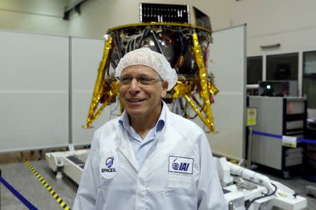 Ido Anteby, SpaceIL's CEO stands in front of an unmanned spacecraft which an Israeli team plans to launch into space at the end of the year and to land it on the Moon next year, in Yahud, Israel, July 10, 2018 REUTERS/Ronen Zvulun