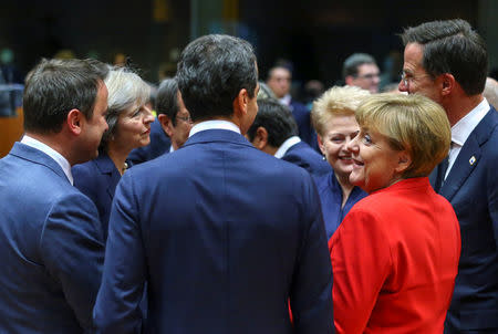 Luxembourg's Prime Minister Xavier Bettel, British Prime Minister Theresa May, Austrian Chancellor Christian Kern, Lithuania's President Dalia Grybauskaite and German Chancellor Angela Merkel attend a European Union leaders summit in Brussels, Belgium October 20, 2016. REUTERS/Yves Herman