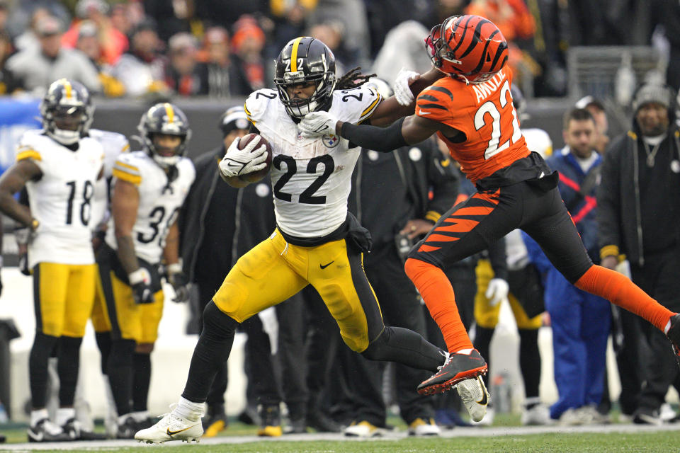 Pittsburgh Steelers running back Najee Harris (22) stiff arms Cincinnati Bengals cornerback Chidobe Awuzie (22) during the second half of an NFL football game in Cincinnati, Sunday, Nov. 26, 2023. The Steelers won 16-10. (AP Photo/Jeffrey Dean)