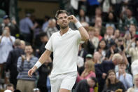 Britain's Cameron Norrie celebrates after beating Czech Republic's Tomas Machac during a first round men's singles match on day two of the Wimbledon tennis championships in London, Tuesday, July 4, 2023. (AP Photo/Kirsty Wigglesworth)