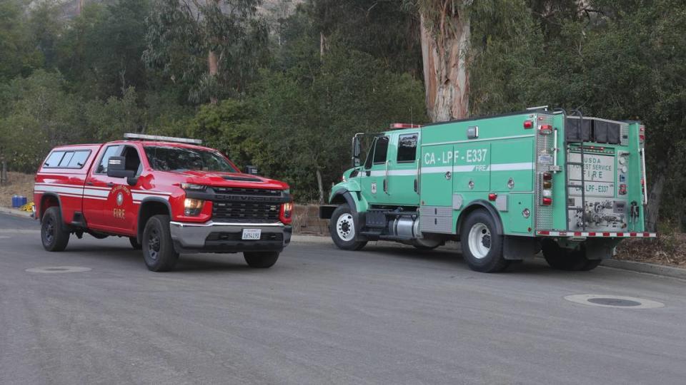 Firefighters rotate to news assignments the second day after the quick moving Lizzie Fire scorched 100 acres in the hills above San Luis High School Oct. 31, 2023.