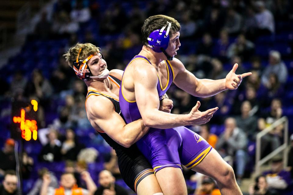 Oklahoma State's Luke Surber, left, wrestles Northern Iowa's Wyatt Voelker at 197 pounds Saturday at the McLeod Center in Cedar Falls.