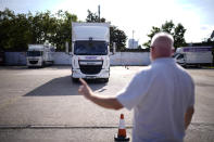 Instructor Graham Bolger directs learner truck driver Cadhene Lubin-Hewitt as he drives at the National Driving Centre in Croydon, south London, Wednesday, Sept. 22, 2021. Lubin-Hewitt, 32, moved to the UK when he was 16 from Trinidad and Tobago and has been driving buses and coaches for about 10 years. Britain doesn't have enough truck drivers. The shortage is contributing to scarcity of everything from McDonald's milkshakes to supermarket produce. (AP Photo/Matt Dunham)