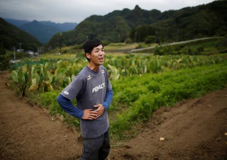 26 year-old farmer Yohka Tanaka speaks at his field in Nanmoku Village, northwest of Tokyo, Japan October 12, 2017. Picture taken October 12, 2017. REUTERS/Issei Kato