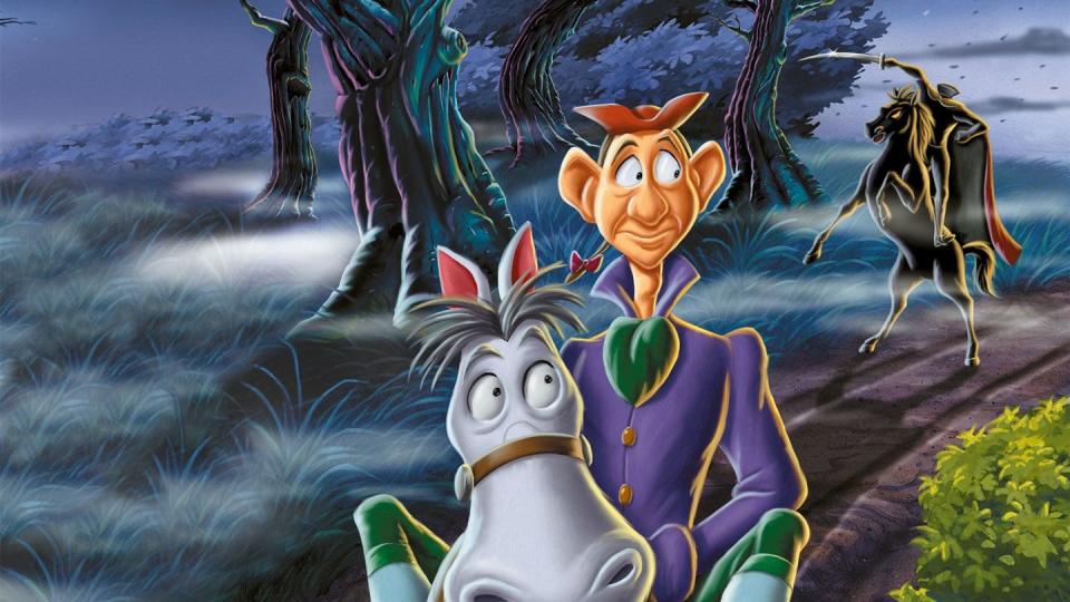 ichabod crane goes riding down a path with the headless horseman behind in a scene from ichabod and mr toad a good housekeeping pick for best scary movies for kids