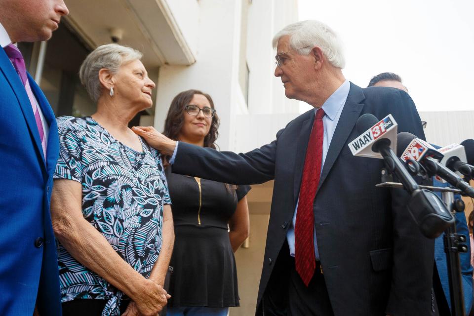 Mark McDaniel, attorney for Casey White, center, looks to Casey White's mother, Connie Moore, during a press conference following the sentence hearing for White, Thursday, June 8, 2023, in Florence, Ala. White, who escaped with help from a jail official who ultimately ended up taking her own life as cops closed in, was sentenced Thursday to life in prison. (Dan Busey/The TimesDaily via AP)