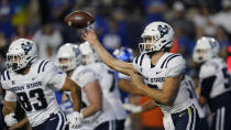 Utah State quarterback Cooper Legas throws a pass during the first half of the team's NCAA college football game against BYU on Thursday, Sept. 29, 2022, in Provo, Utah. (AP Photo/Rick Bowmer)