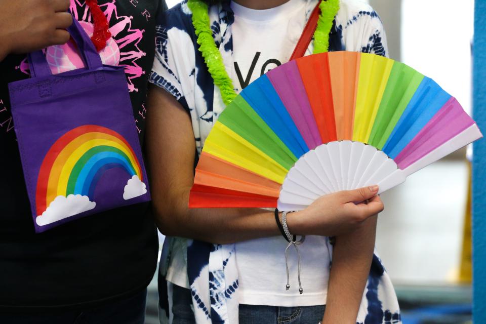 Cristina Macias, left, and Lotus Macias hold up goodies they received from Pride Corpus Christi's organization at In the Game Funtrackers Thursday, June 9, 2022.