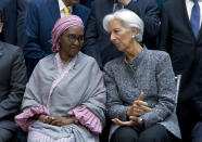 International Monetary Fund (IMF) Managing Director Christine Lagarde speaks with Nigeria's Finance Minister Zainab Ahmed, during the International Monetary Fund IMF Governors group photo at the World Bank/IMF Spring Meetings in Washington, Saturday, April 13, 2019. (AP Photo/Jose Luis Magana)