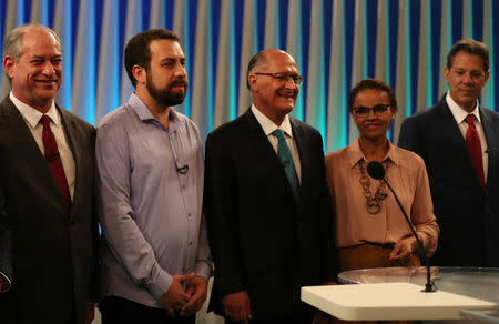 Presidential candidates (L-R) Ciro Gomes, Guilherme Boulos, Geraldo Alckmin, Marina Silva and Fernando Haddad pose ahead of a televised debate in Rio de Janeiro, Brazil October 4, 2018. REUTERS/Ricardo Moraes