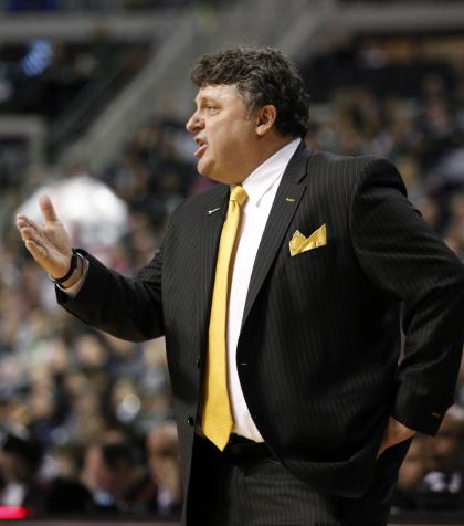 Oakland coach Greg Kampe's program has been affected by cancer during the last year. (AP)