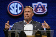 FILE - Auburn head coach Hugh Freeze speaks during NCAA college football Southeastern Conference Media Days, Tuesday, July 18, 2023, in Nashville, Tenn. Jimbo Fisher and Hugh Freeze have enjoyed considerable success as offensive playcallers. Now, the Southeastern Conference head coaches appear poised to relinquish that role to new offensive coordinators and focus on the bigger picture of running a program in the era of NIL, the transfer portal and December signing periods.(AP Photo/George Walker IV, File)