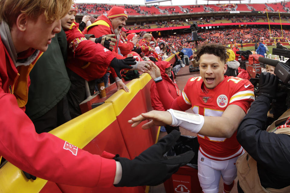 Kansas City Chiefs quarterback Patrick Mahomes (15) celebrates with fans after an NFL football game against the Los Angeles Chargers, Sunday, Dec. 29, 2019, in Kansas City, Mo. (AP Photo/Charlie Riedel)