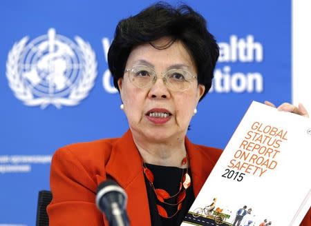World Health Organization Director-General Margaret Chan holds the Global Status Report on Road Safety 2015 during a news conference at the WHO headquarters in Geneva, Switzerland, October 19, 2015. REUTERS/Denis Balibouse