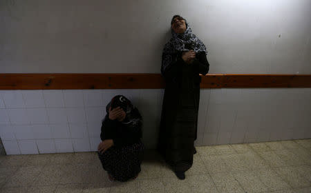 Relatives of Palestinian nurse Razan Al-Najar, who was killed during a protest at the Israel-Gaza border, react at a hospital in the southern Gaza Strip June 1, 2018. REUTERS/Ibraheem Abu Mustafa