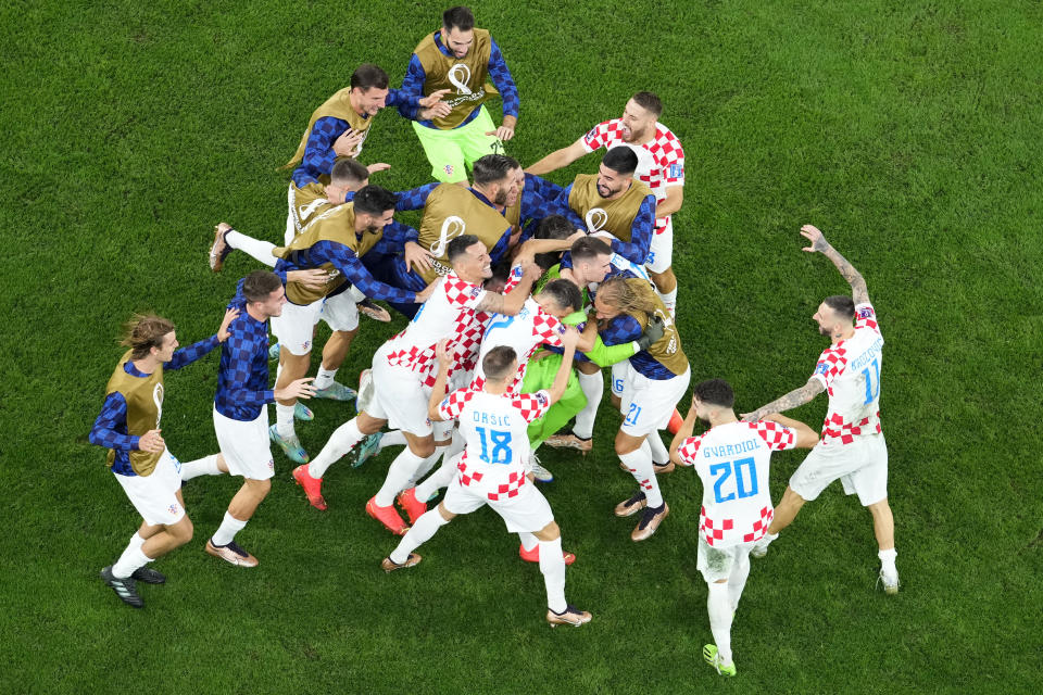 Croatia's players celebrate winning the World Cup quarterfinal soccer match between Croatia and Brazil, at the Education City Stadium in Al Rayyan, Qatar, Friday, Dec. 9, 2022. (AP Photo/Petr David Josek)