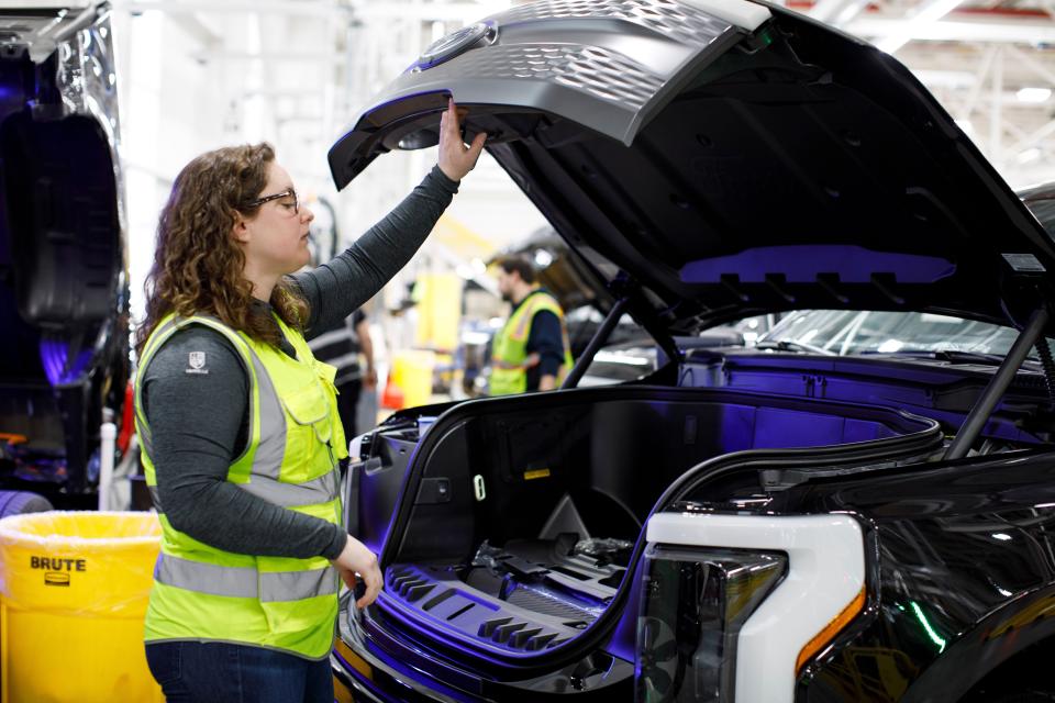 Megan Gegesky, program management launch supervisor for the 2022 Ford F-150 Lightning, seen here inspecting the vehicle at the factory in early April.