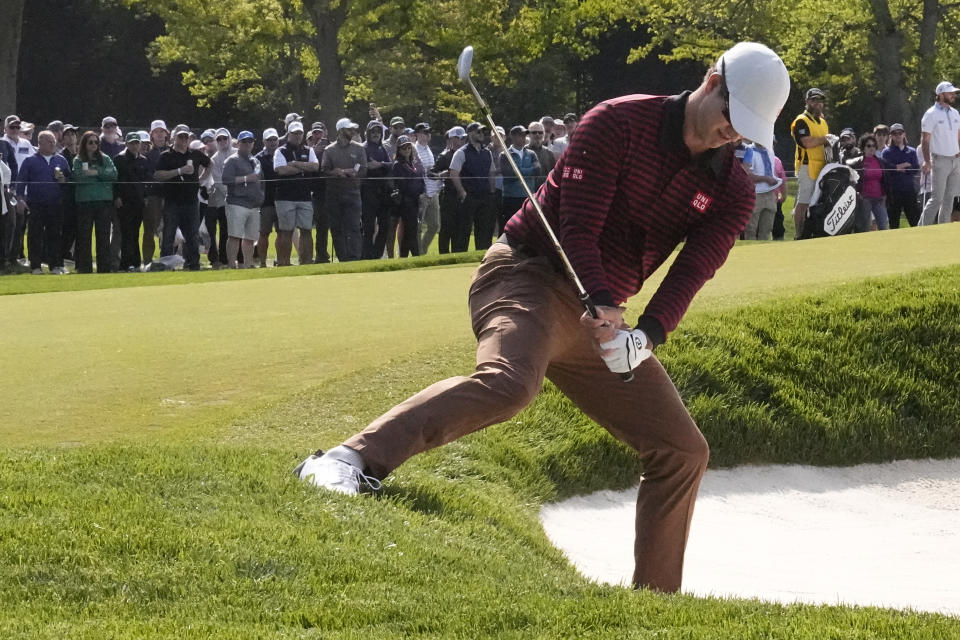 Adam Scott, of Australia, hits from the bunker on the fourth hole during the first round of the PGA Championship golf tournament at Oak Hill Country Club on Thursday, May 18, 2023, in Pittsford, N.Y. (AP Photo/Eric Gay)