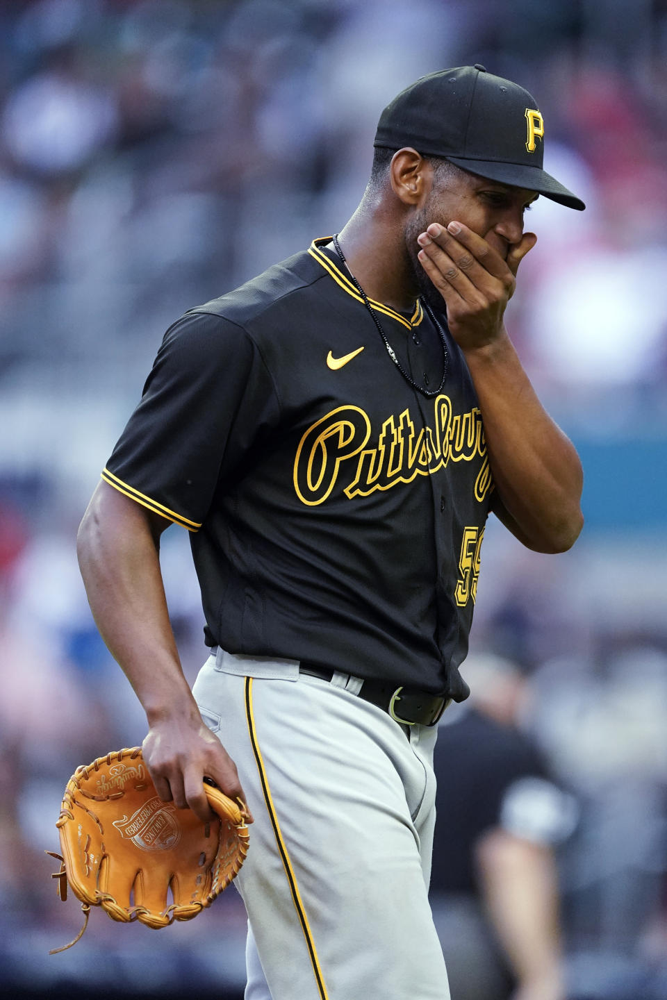 Pittsburgh Pirates starting pitcher Roansy Contreras walks to the dugout after recording the final out in the third inning of the team's baseball game Atlanta Braves on Friday, June 10, 2022, in Atlanta. (AP Photo/John Bazemore)