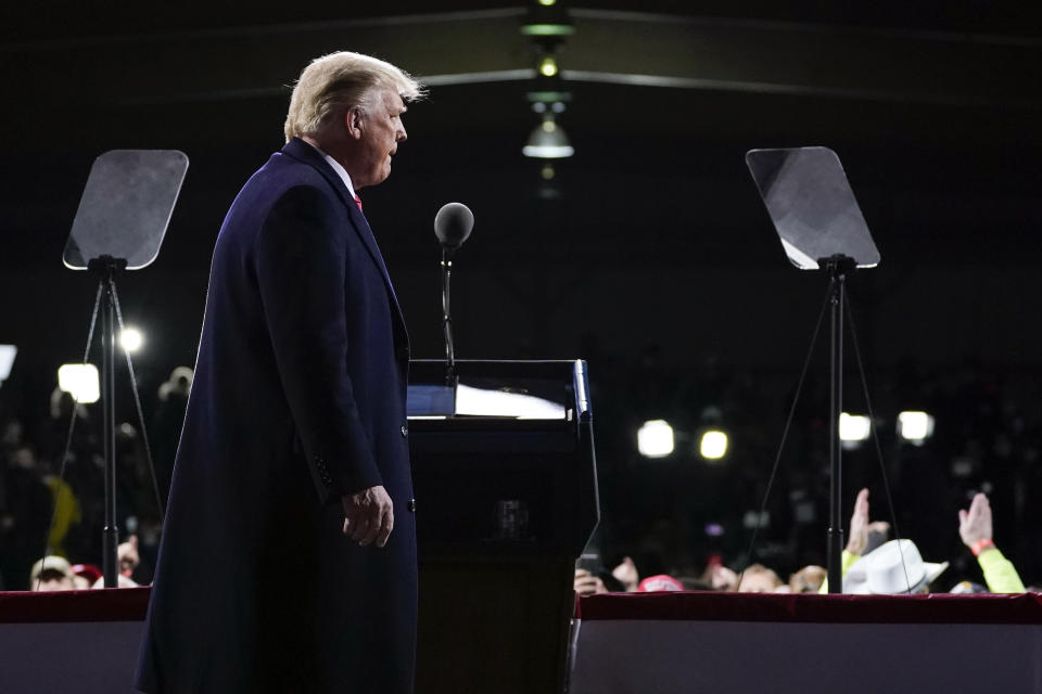 President Donald Trump arrives to speak at a campaign rally for Senate Republican candidates, Sen. Kelly Loeffler, R-Ga., and Sen. David Perdue, R-Ga., at Valdosta Regional Airport, Saturday, Dec. 5, 2020, in Valdosta, Ga. (AP Photo/Evan Vucci)