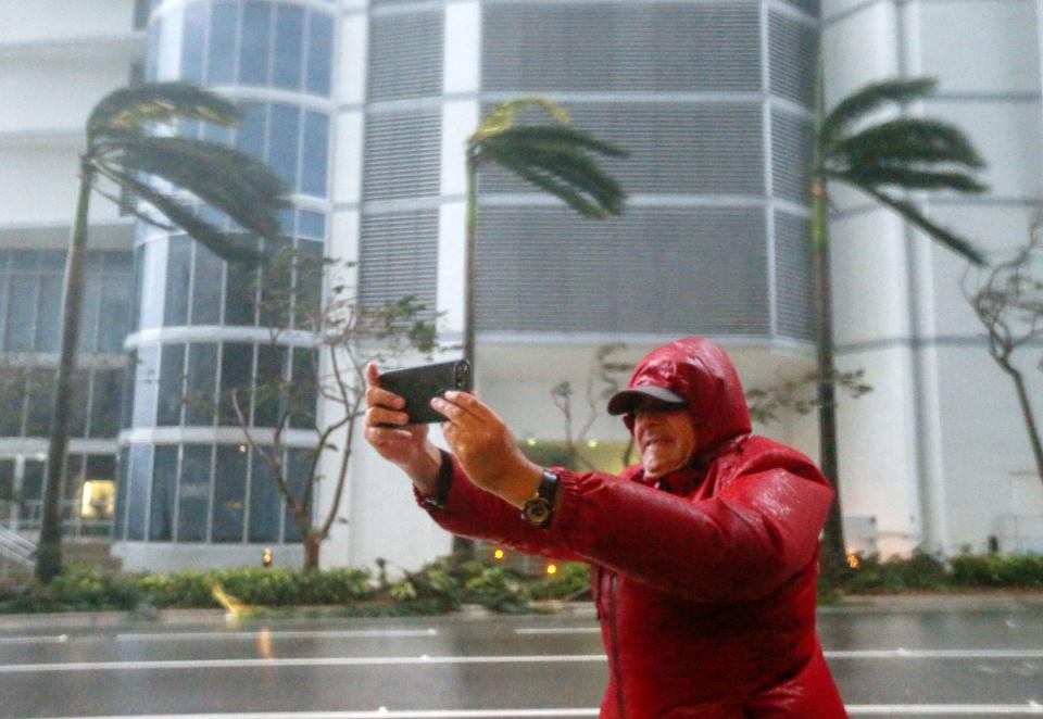 <p><strong>Miami</strong><br>A person photographs the fierce winds with his mobile phone as the full effects of Hurricane Irma strike in Miami, Fla., Sept. 10, 2017. (Photo: Erik S. Lesser/EPA-EFE/REX/Shutterstock) </p>