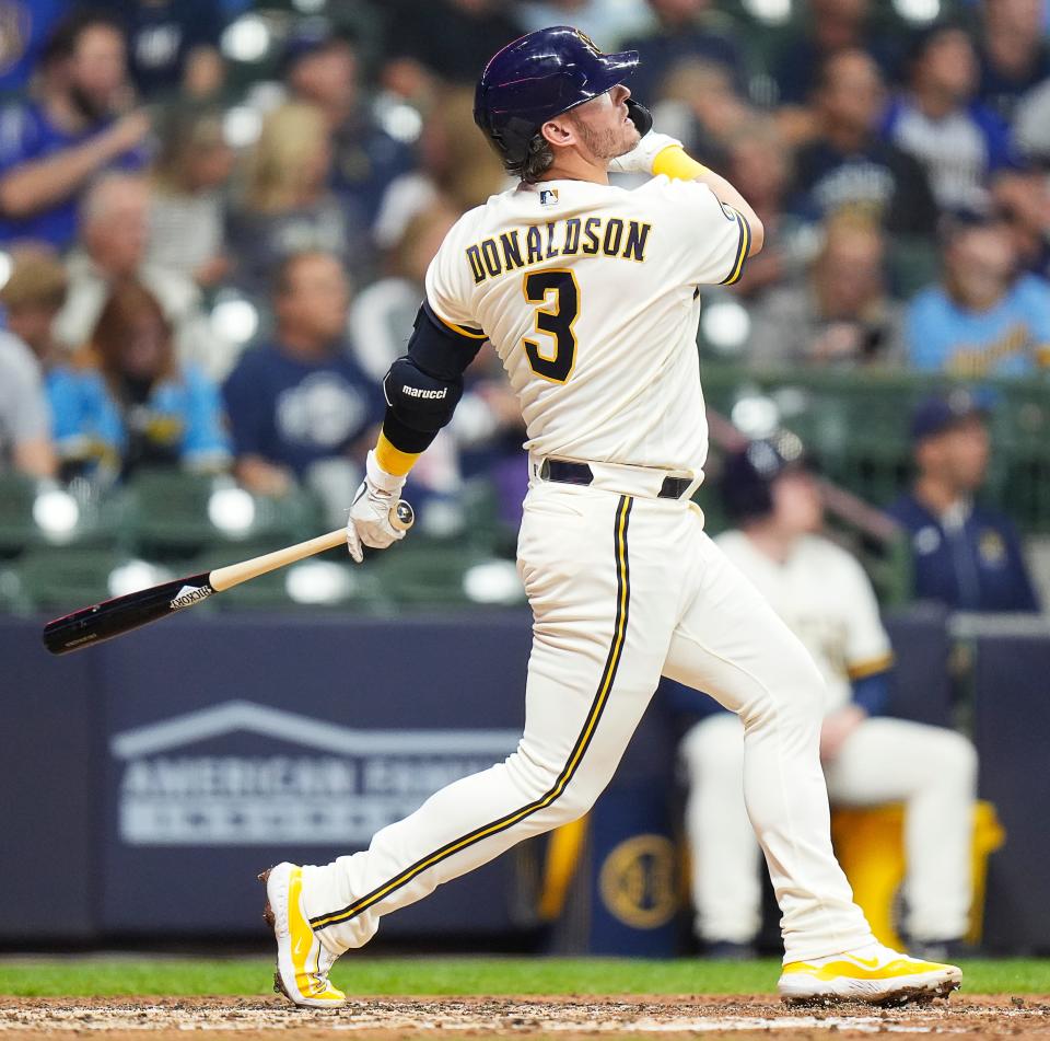 Milwaukee Brewers designated hitter Josh Donaldson (3) homers on a fly ball to left field during the fourth inning of the game against the Miami Marlins on Tuesday September 12, 2023 at American Family Field in Milwaukee, Wis.