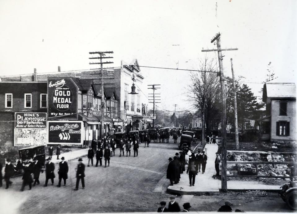 Before the Lafayette Theater opened, on March 3, 1924, the newest venue on Lafayette Avenue was Hines Play House, the building of which still stands. Here, a parade makes its way down Lafayette Avenue, past a sign advertising "Hine's Playhouse."