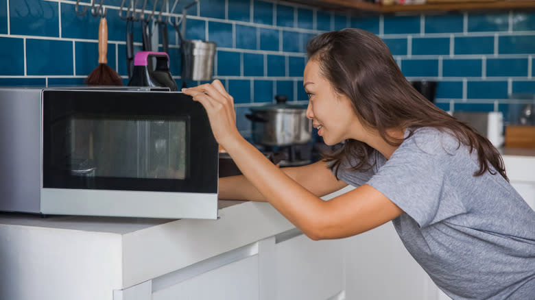 Person using a microwave