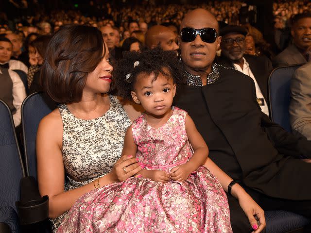 Kevin Mazur/WireImage Tomeeka Robyn Bracy and Stevie Wonder with their daughter in 2015.