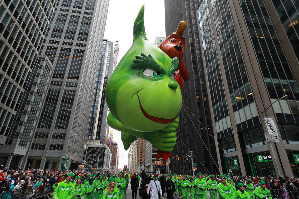 The deliciously wicked Grinch and his loyal dog, Max, are stealing Christmas and the spotlight on the Parade route this Thanksgiving with a sack full of toys and a subversive smile. (Photo: Gordon Donovan/Yahoo News) 