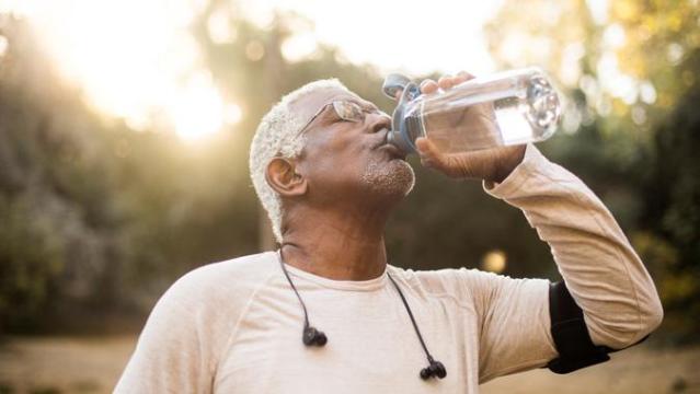 Young Woman Holding A Water Bottle High-Res Stock Photo - Getty Images