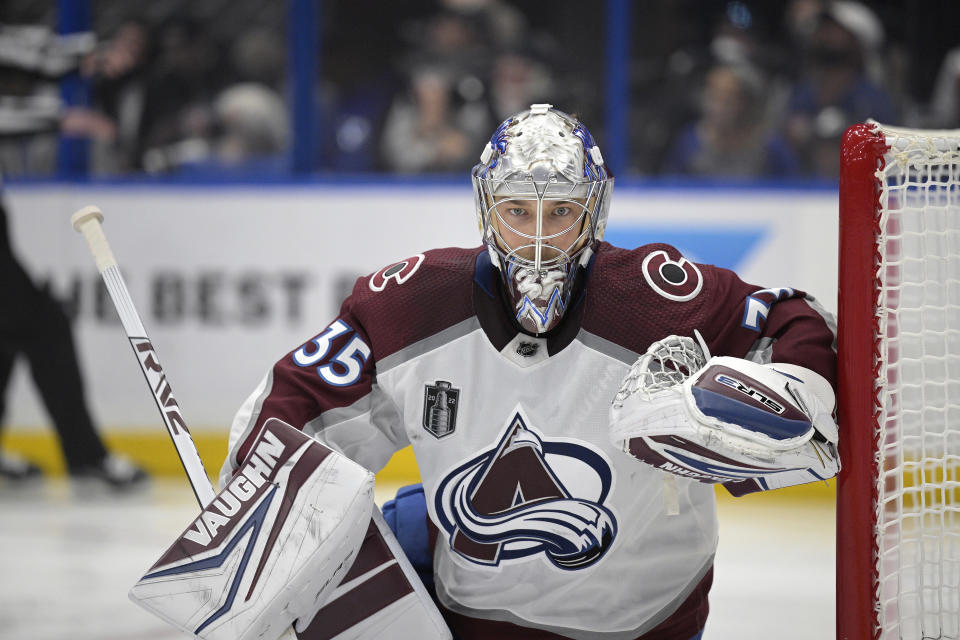 FILE - Colorado Avalanche goaltender Darcy Kuemper (35) kneels in front of the goal during the first period of Game 6 of the NHL hockey Stanley Cup Finals against the Tampa Bay Lightning on Sunday, June 26, 2022, in Tampa, Fla. The goalie shuffle around the NHL continued when free agency opened Wednesday, July 13, 2022, with the Washington Capitals signing a Stanley Cup champion to stabilize the position and the Edmonton Oilers trying to do the same. The Capitals signed Darcy Kuemper to a $26.25 million, five-year contract fresh off him backstopping the Colorado Avalanche to their first title since 2001. (AP Photo/Phelan M. Ebenhack, File)