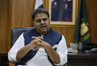 Pakistan's Information Minister Fawad Chaudhry speaks about violence against women during an interview with The Associated Press, in Islamabad, Pakistan, Tuesday, July 27, 2021. The beheading of a young woman in an upscale neighborhood of Pakistan's capital has shone a spotlight on the relentless violence against women in the country. Rights activists say such gender-based assaults are on the rise as Pakistan barrels toward greater religious extremism. (AP Photo/Anjum Naveed)