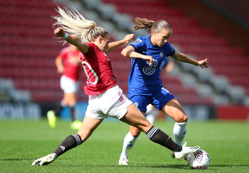 LEIGH, ENGLAND - SEPTEMBER 06:  Kirsty Smith of Manchester United Women tackles Guro Reiten of Chelsea Women during the Barclays FA Women's Super League at Leigh Sports Village on September 06, 2020 in Leigh, England. (Photo by James Gill - Danehouse/Getty Images)