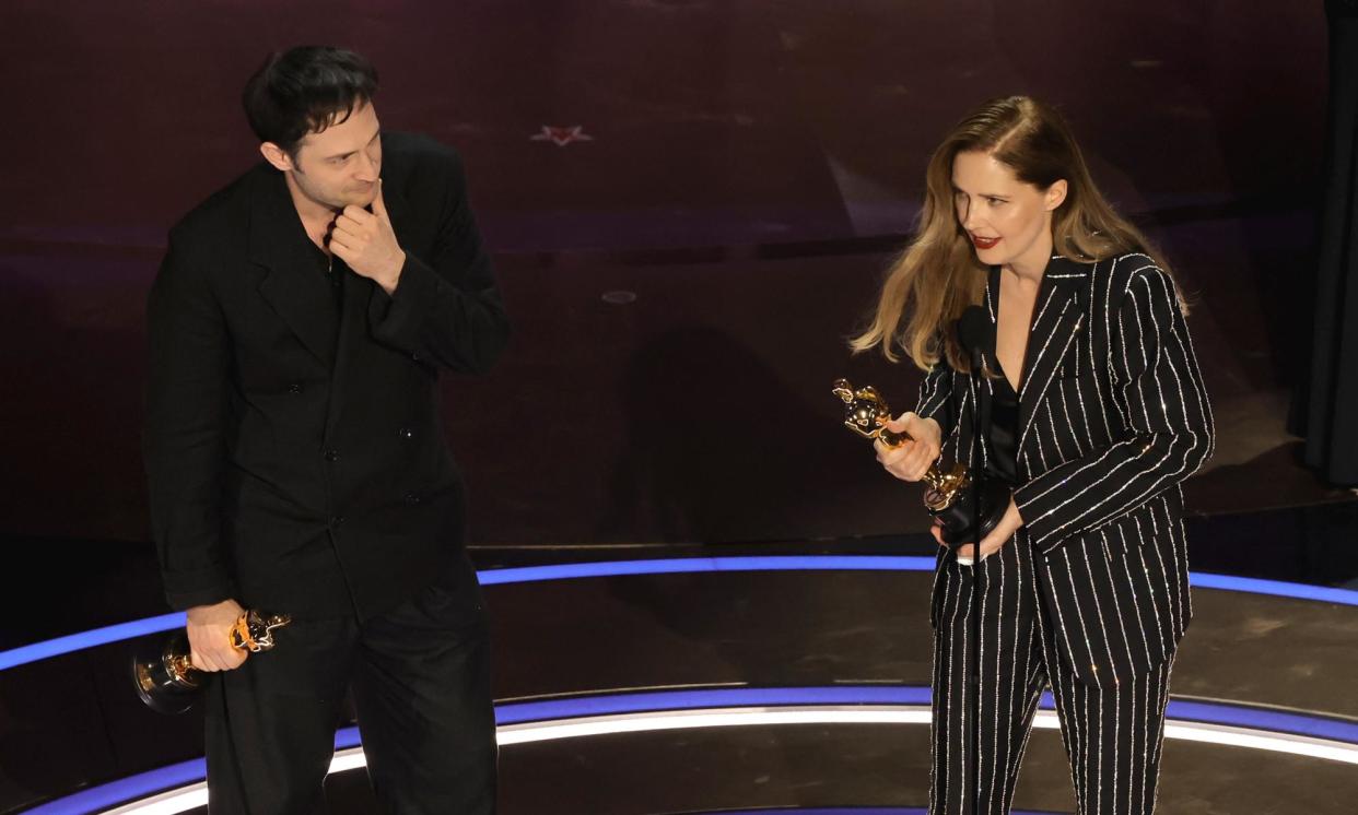 <span>Arthur Harari and Justine Triet accept the best original screenplay Oscar.</span><span>Photograph: Kevin Winter/Getty Images</span>