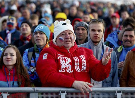 Russian fans watch a broadcast of the men's ice hockey quarter-final match between Russia and Finland in the Olympic Park during the 2014 Winter Olympic Games in Sochi February 19, 2014. REUTERS/Shamil Zhumatov