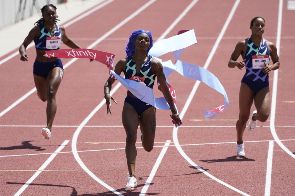 FILE - Sha'Carri Richardson, center, wins the women's 100-meter dash final race during the USATF Golden Games athletics meet at Mount San Antonio College in Walnut, Calif., in this Sunday, May 9, 2021, file photo. At left is Teahna Daniels and at right is Briana Williams. The U.S. Olympic track trials begin Friday night, June 18, at remodeled Hayward Field. Richardson will be trying to make the team. (AP Photo/Ashley Landis, File)