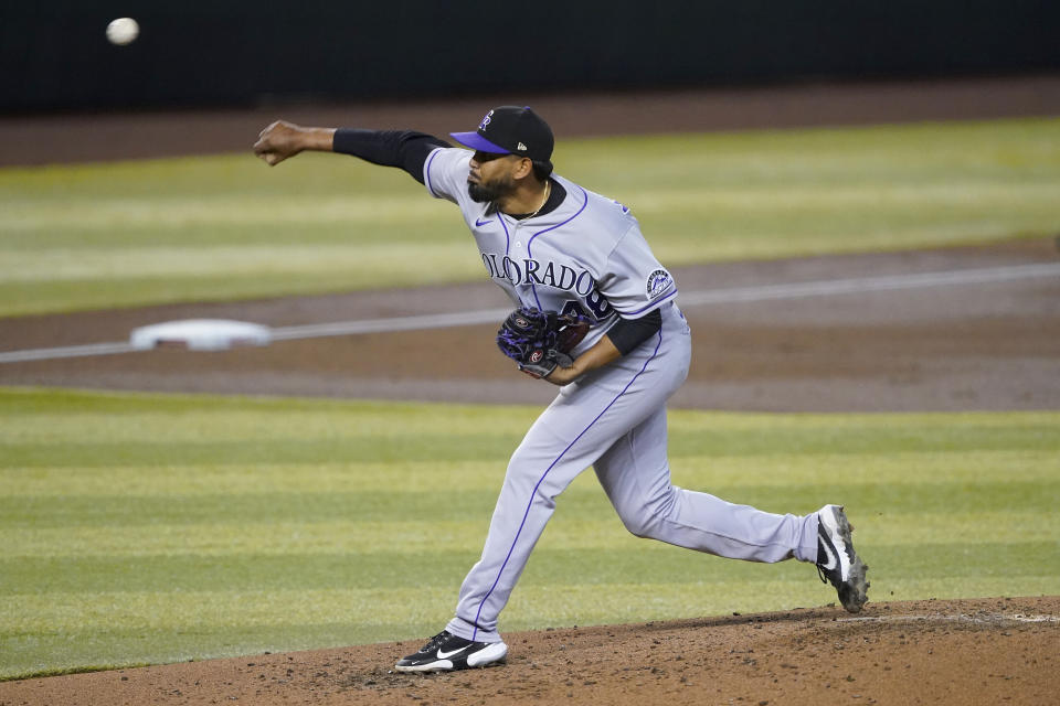 Colorado Rockies starting pitcher German Marquez throws against the Arizona Diamondbacks during the second inning of a baseball game, Saturday, Sept. 26, 2020, in Phoenix. (AP Photo/Matt York)