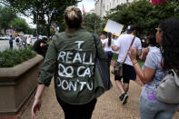 <p>A protester wears a top reading “I really do care, Don’t U” as she joins demonstrators rally and march calling for “an end to family detention” and in opposition to the immigration policies of the Trump administration in Washington, D.C., June 28, 2018. (Photo: Jonathan Ernst/Reuters) </p>