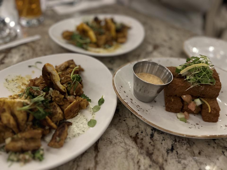 Spice Road Table's hummus fries and spiced chicken. (Photo: Terri Peters)